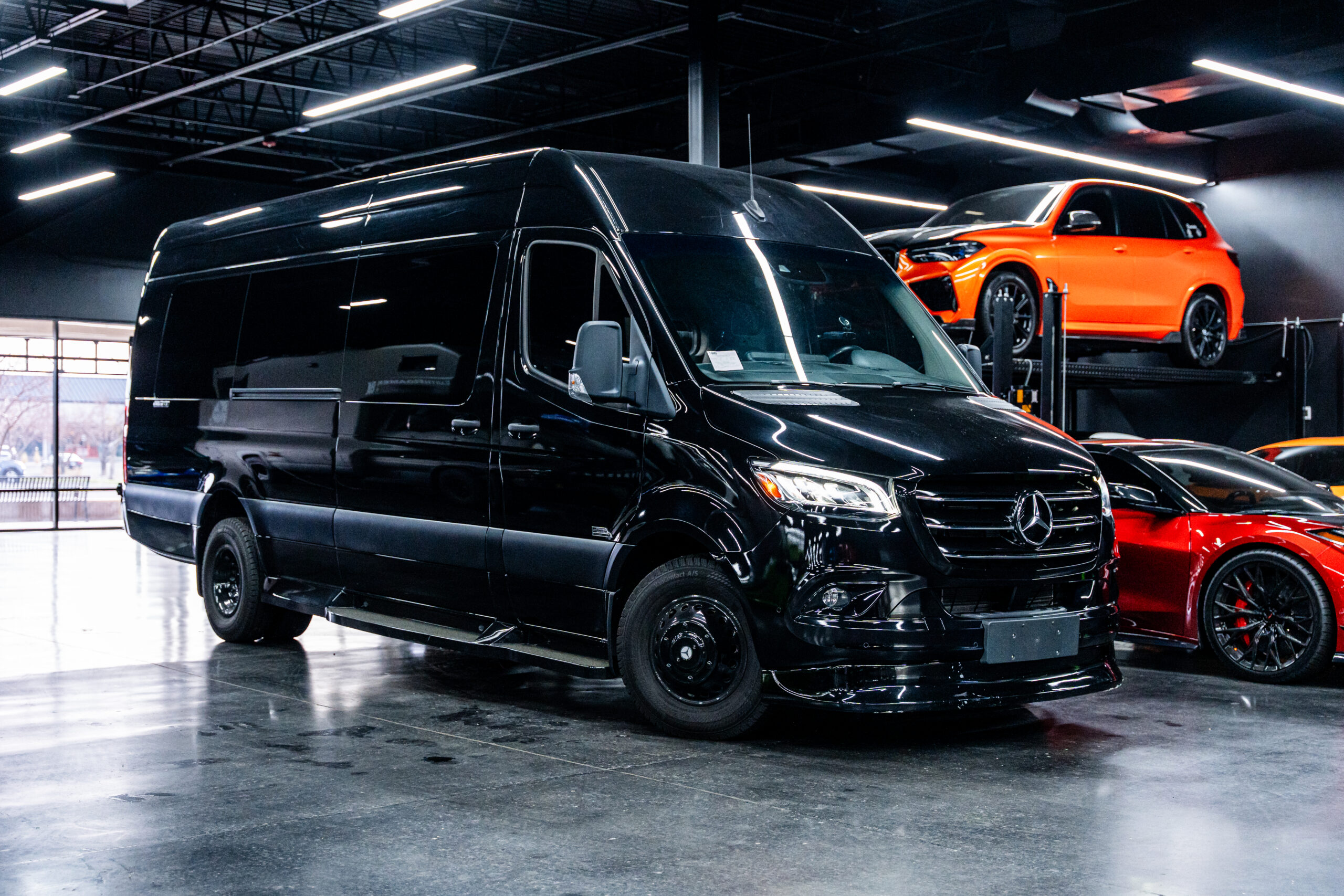 The 2023 Mercedez Benz Sprinter Office Van in black, featuring a sleek exterior design, large front windows, and durable construction made for versatile commercial use.