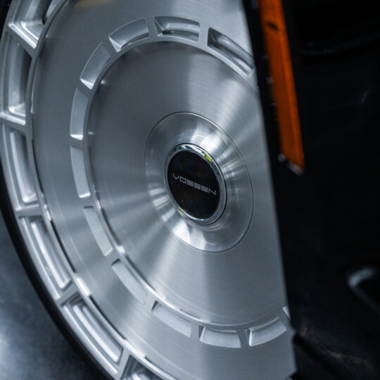 The wheel of the 2025 Mercedes-Benz G63 AMG features a polished silver alloy design, showcasing a sleek, modern pattern with a center cap bearing the brand logo, highlighting its premium aesthetic.